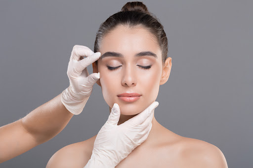 Plastic Surgeon Analyzing Woman's Facial Harmony